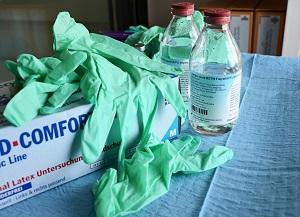 This image features latex gloves and various chemicals, designed to show the different products in a medical environment.